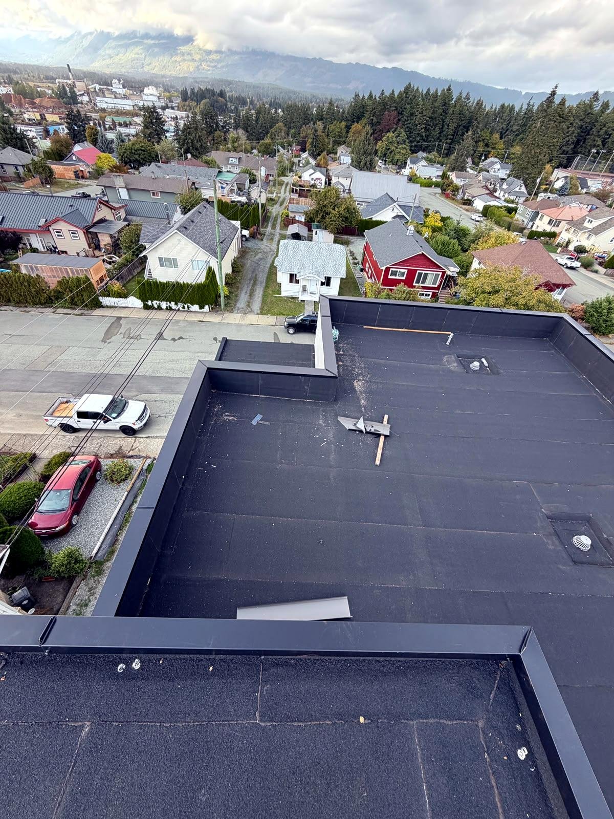 Completed torch-on flat roof with new parapet flashing in Nanaimo, BC